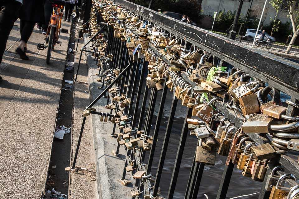Love locks on railing on Puente Racamalac, Santiago Chile 